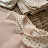 Tutina in ciniglia rosa con dettagli fiorellini HE52G BabyGi