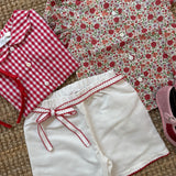 Shorts bianco con orlo profilo rosso centinato e cinturino con fiocco La Mascot 55/2501377