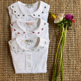 Polo colletto petalo con ricamo fiori malva Malvi & Co S26M022CAJJ