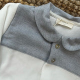 Tutina spezzata in ciniglia latte con dettaglio spigato polvere WY55B