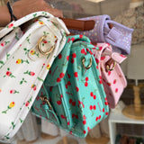 Borsa cartella media con tracolla bianco con fiorellini colorati Naj-Oleari