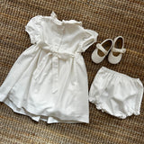 Abito battesimale newborn in twill latte ricamo punto smock rosa F25I130VEZL