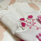 Completo t-shirt con fiori uncinetto e pantalone 3/4 vichy goffrato fuxia/bianco S24I113CAJJ S24I120PNQQ