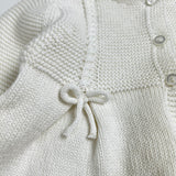 Cardigan newborn latte con fiocchetti DK117