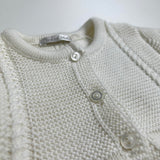 Cardigan newborn latte con fiocchetti DK117